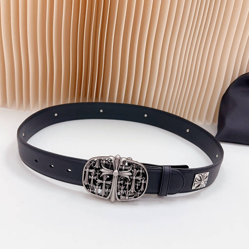 Navy leather belt with ornate silver buckle and studded holes