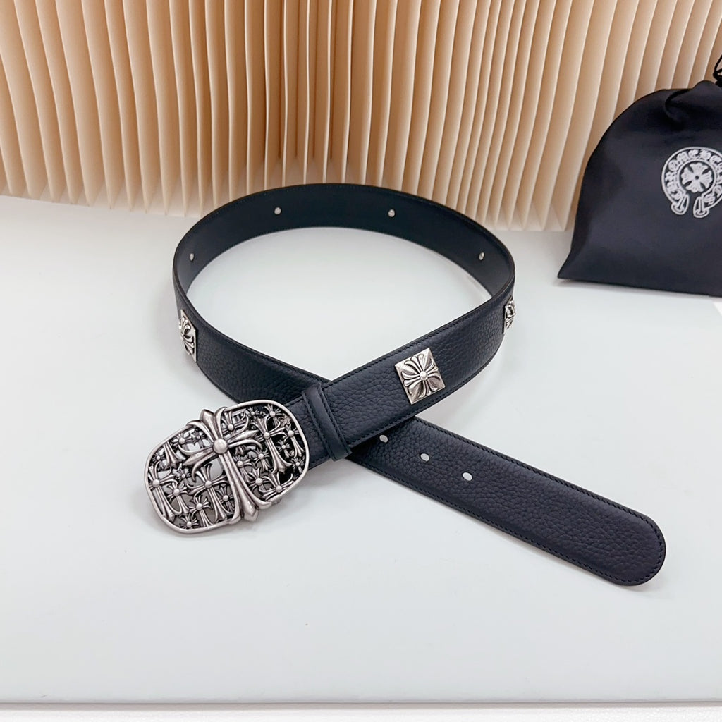 Navy leather belt with large ornate silver buckle and cross plates