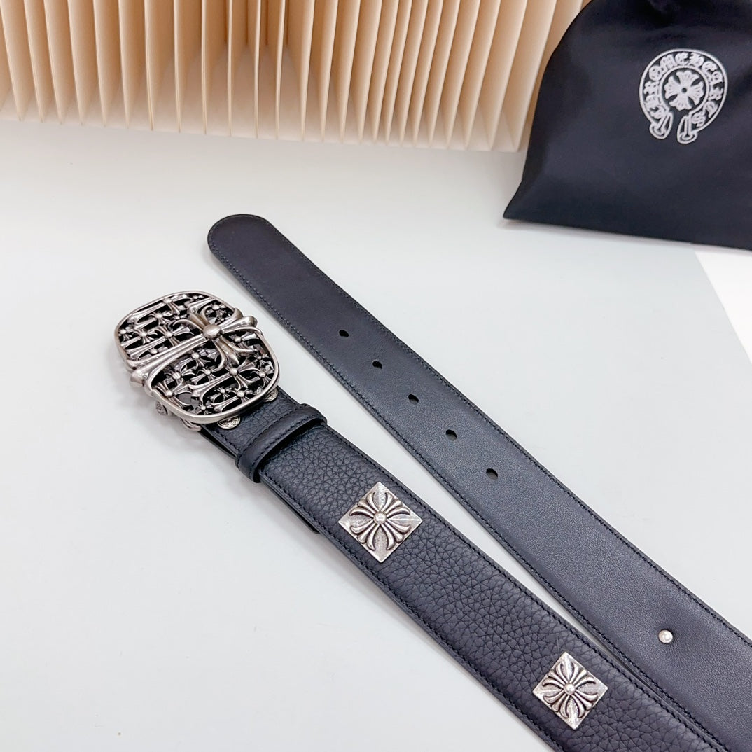 Navy leather belt with ornate silver buckle and cross decorative studs