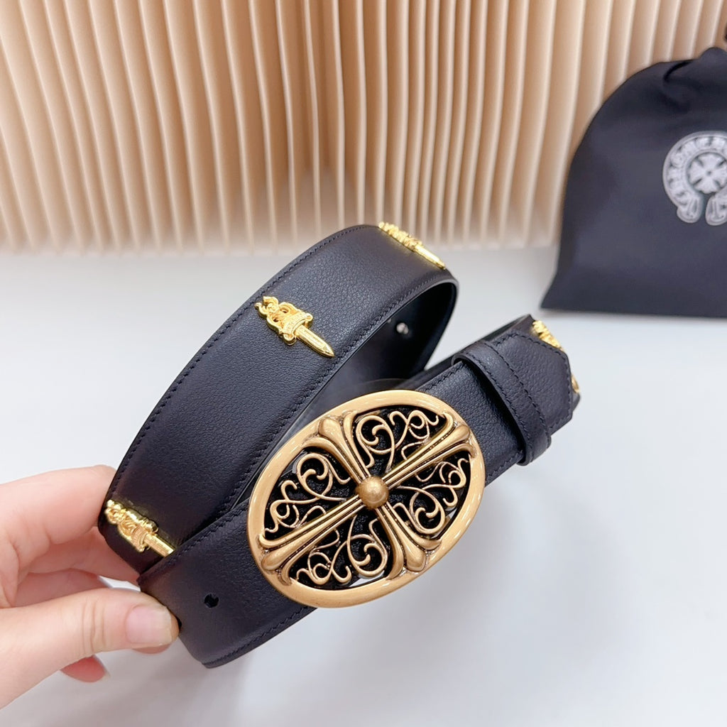 Dark leather belt close-up with gold filigree buckle and decorative bar accents