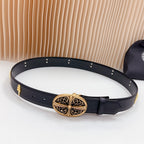 Dark leather belt with gold filigree buckle and decorative stud accents