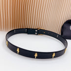Dark leather belt with gold emblem studs and a gold-tone ornate buckle