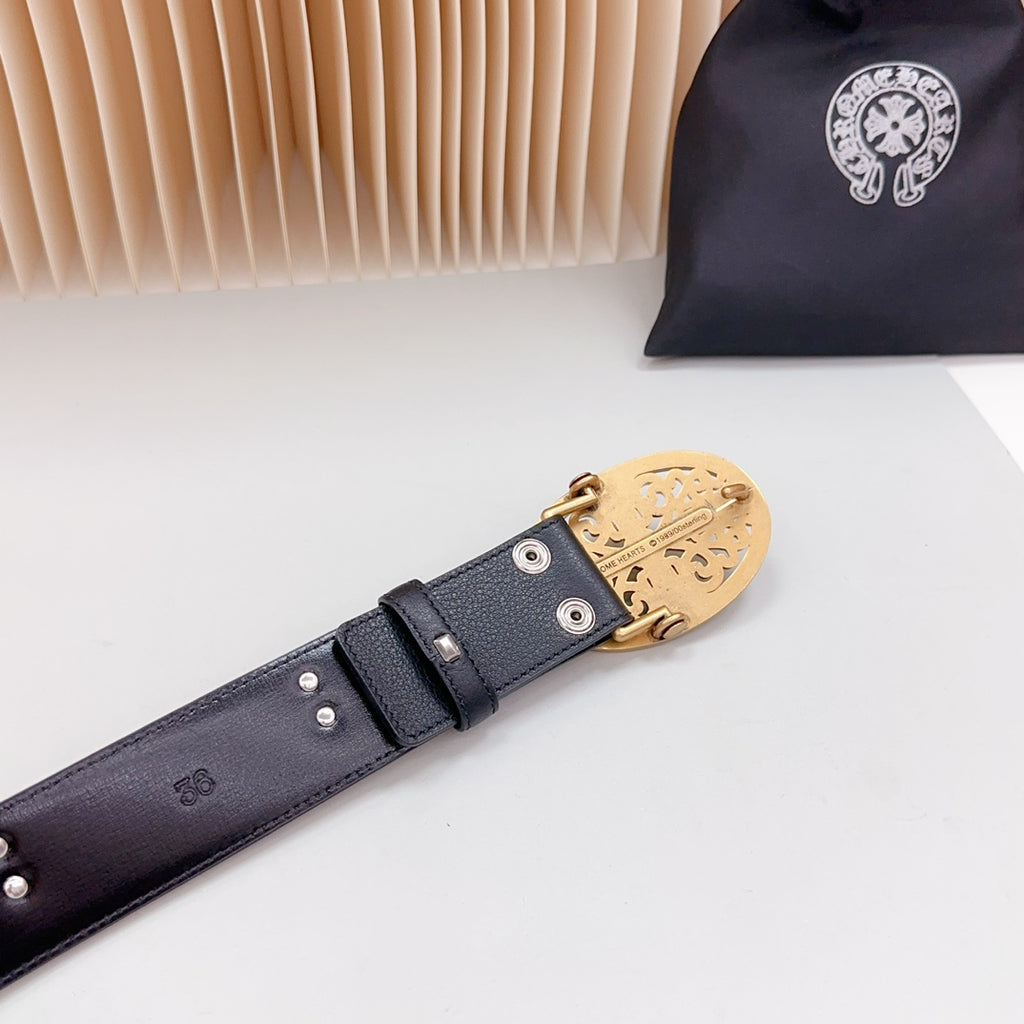 Dark leather belt with gold-toned buckle hardware and metal rivets