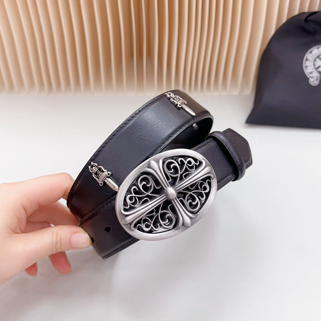 Dark leather belt with ornate oval silver buckle, pin closure, and studs