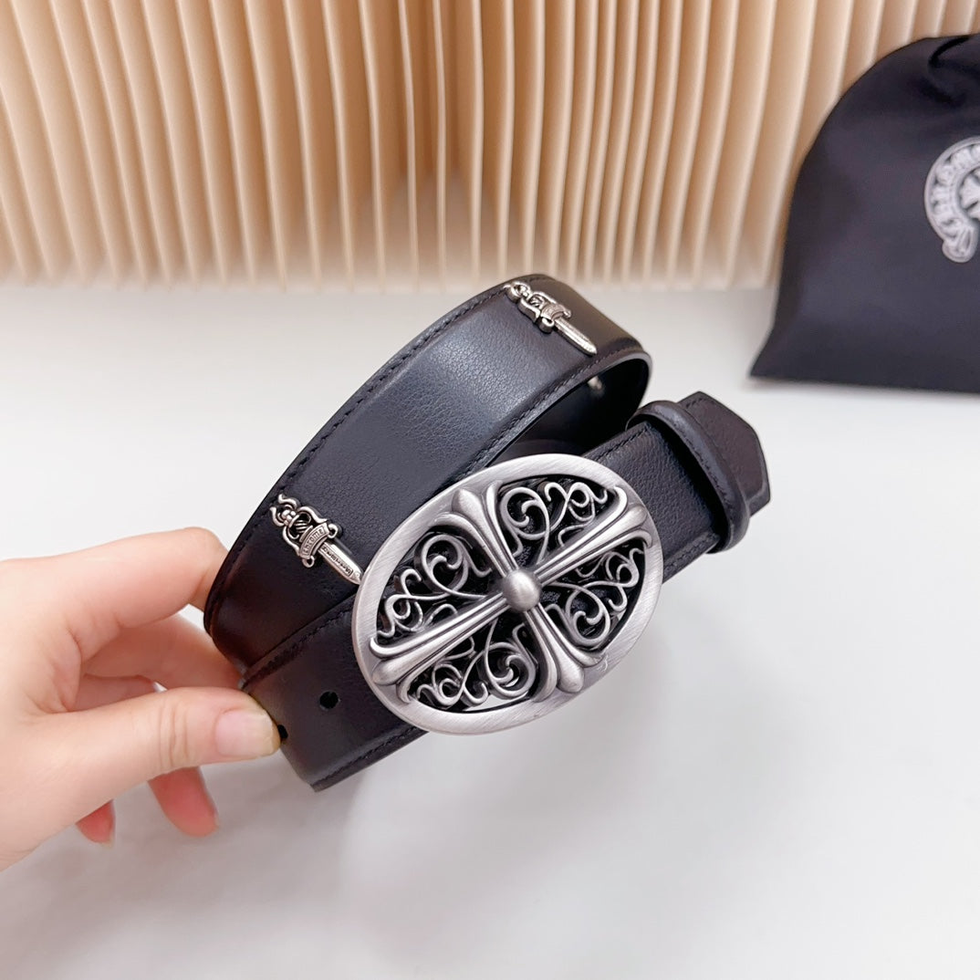 Dark leather belt with ornate oval silver buckle, pin closure, and studs