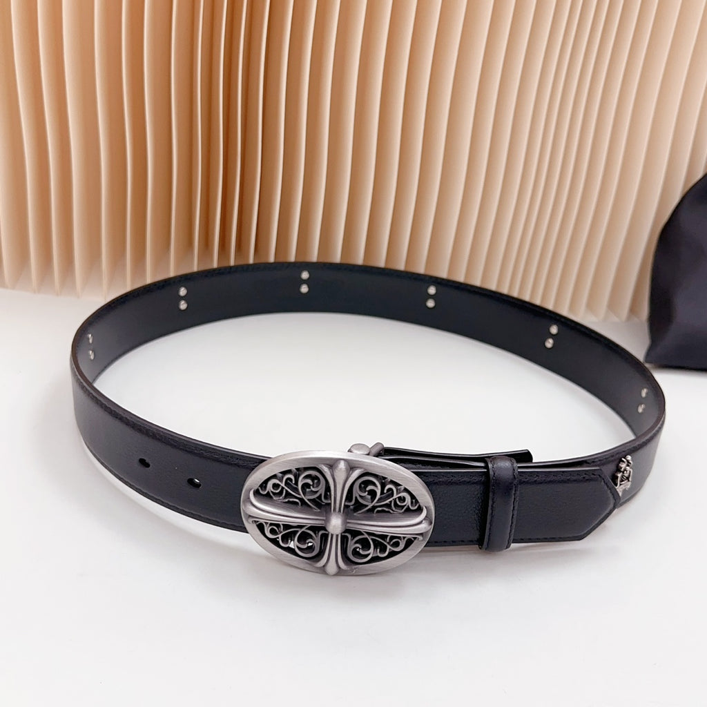 Dark leather belt with oval decorative silver buckle and punched holes