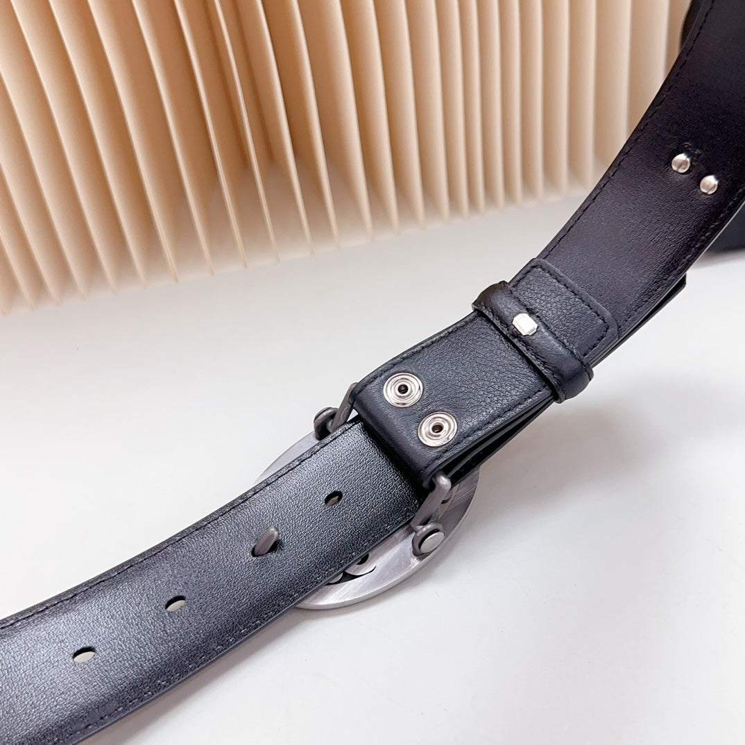 Dark leather belt close-up of adjustment strap with silver-tone fasteners