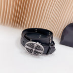 Dark leather belt with oval decorative silver buckle and looped strap ends