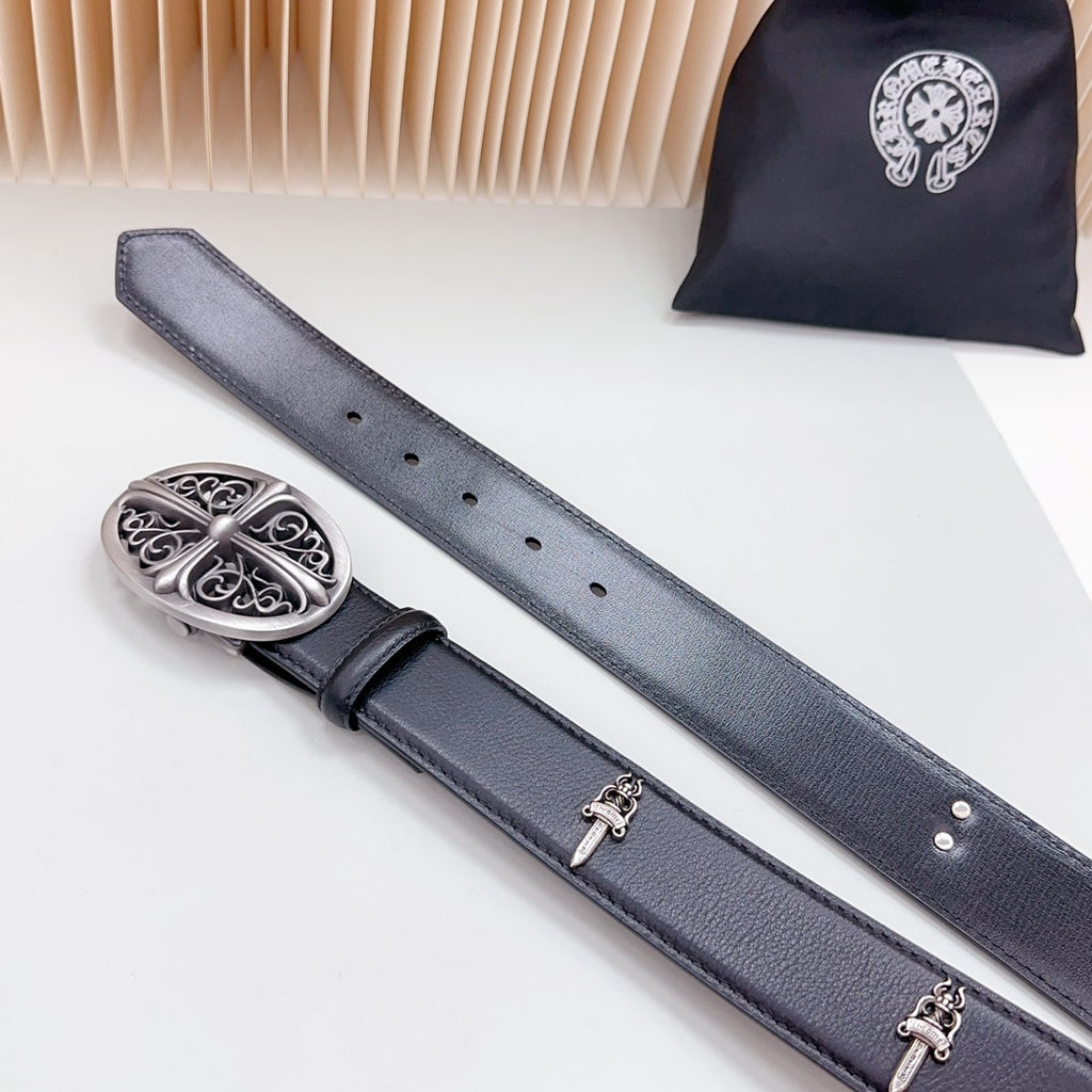 Dark leather belt with decorative oval silver buckle and two hanging strap ends