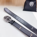 Dark leather belt with decorative oval silver buckle and two hanging strap ends