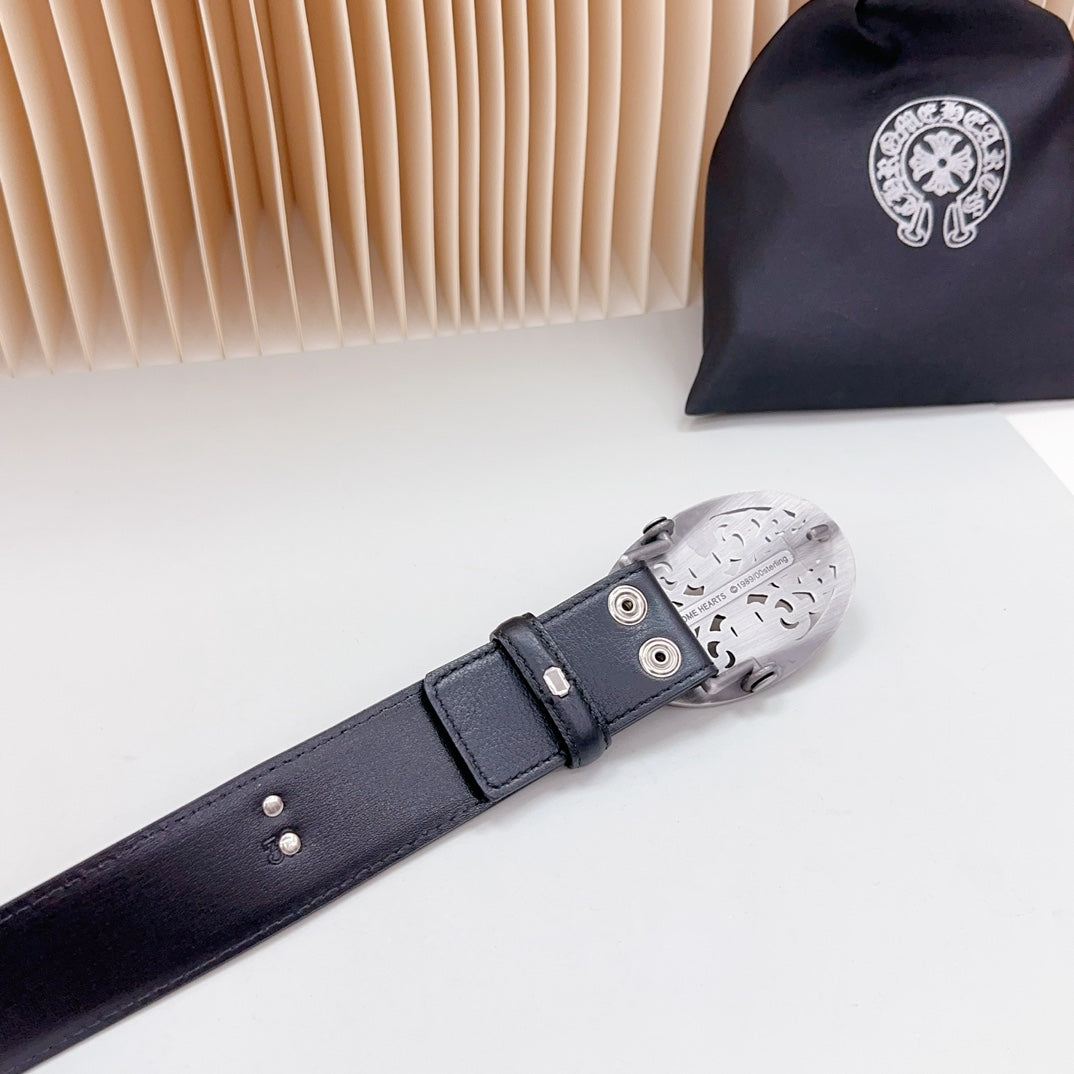 Dark leather belt end with adjustable holes and silver-tone clasp hardware