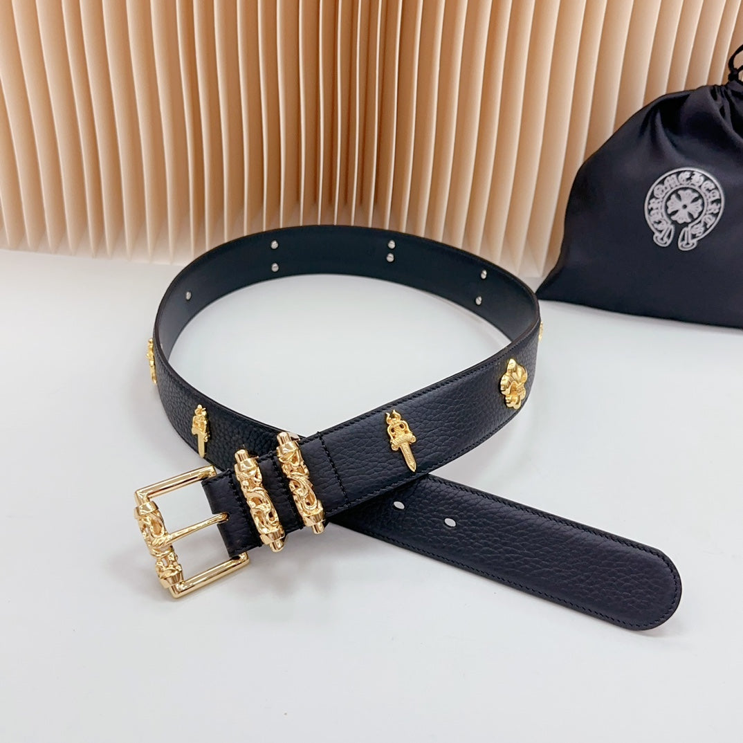 Dark blue leather belt with gold buckle, vertical charm ornaments, and stud holes