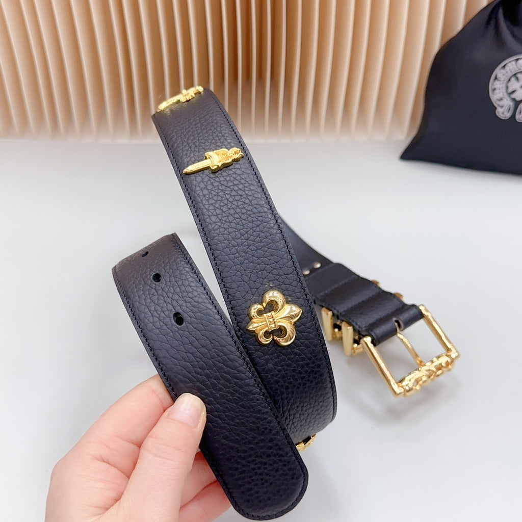 Dark blue leather belt with gold buckle and clover charm, plus matching strap piece