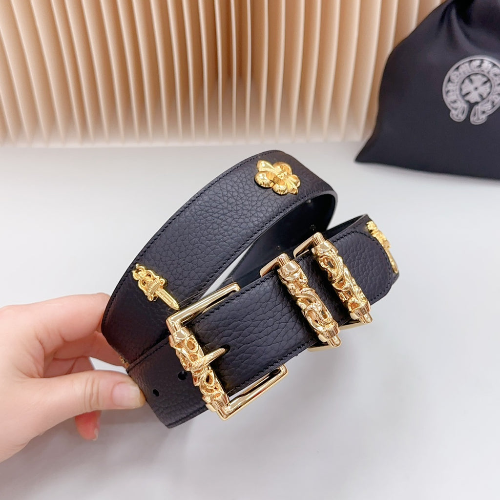 Dark blue leather belt end with gold buckle, cross charm, and stud holes
