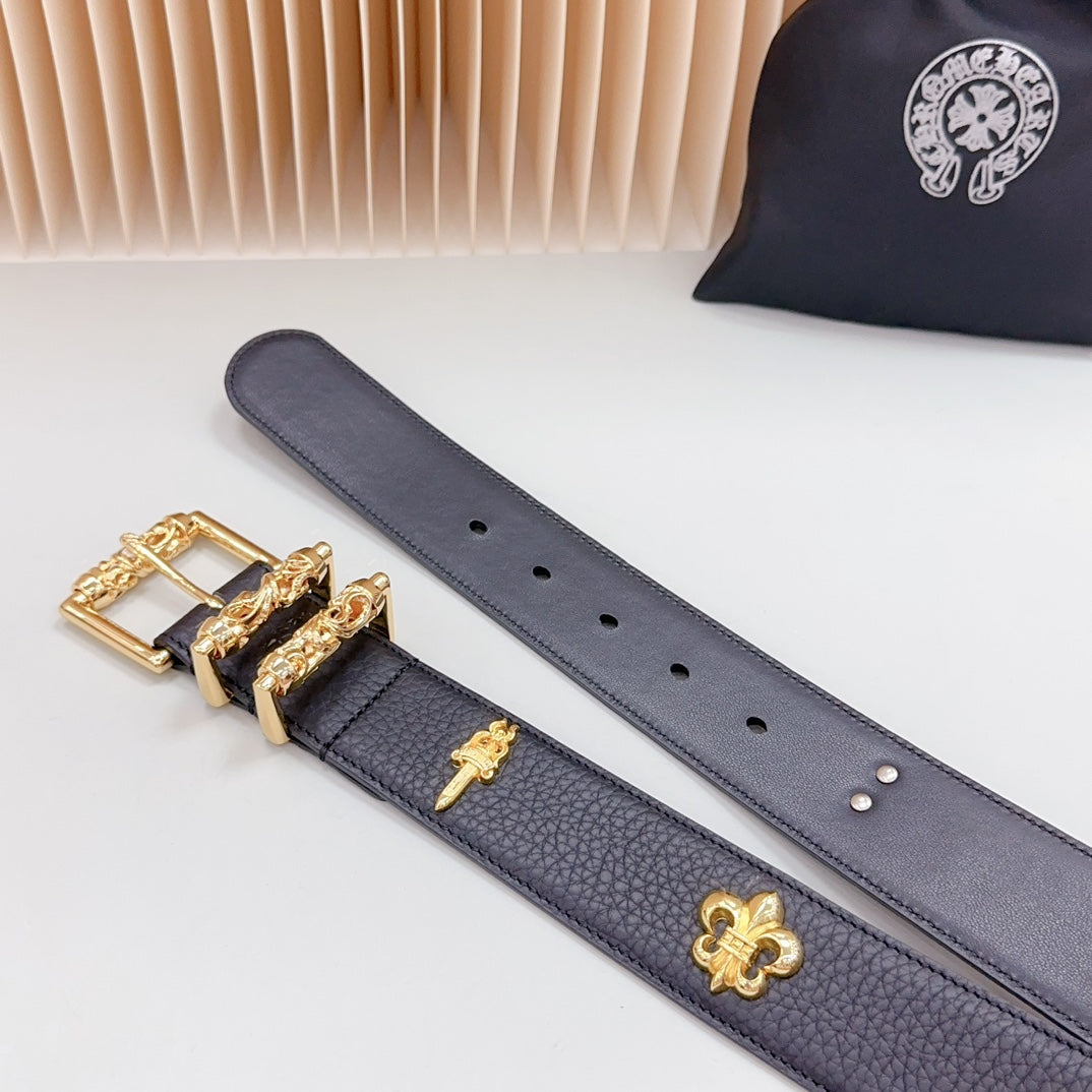 Dark blue leather belt with gold buckle and clover charm, shown flat