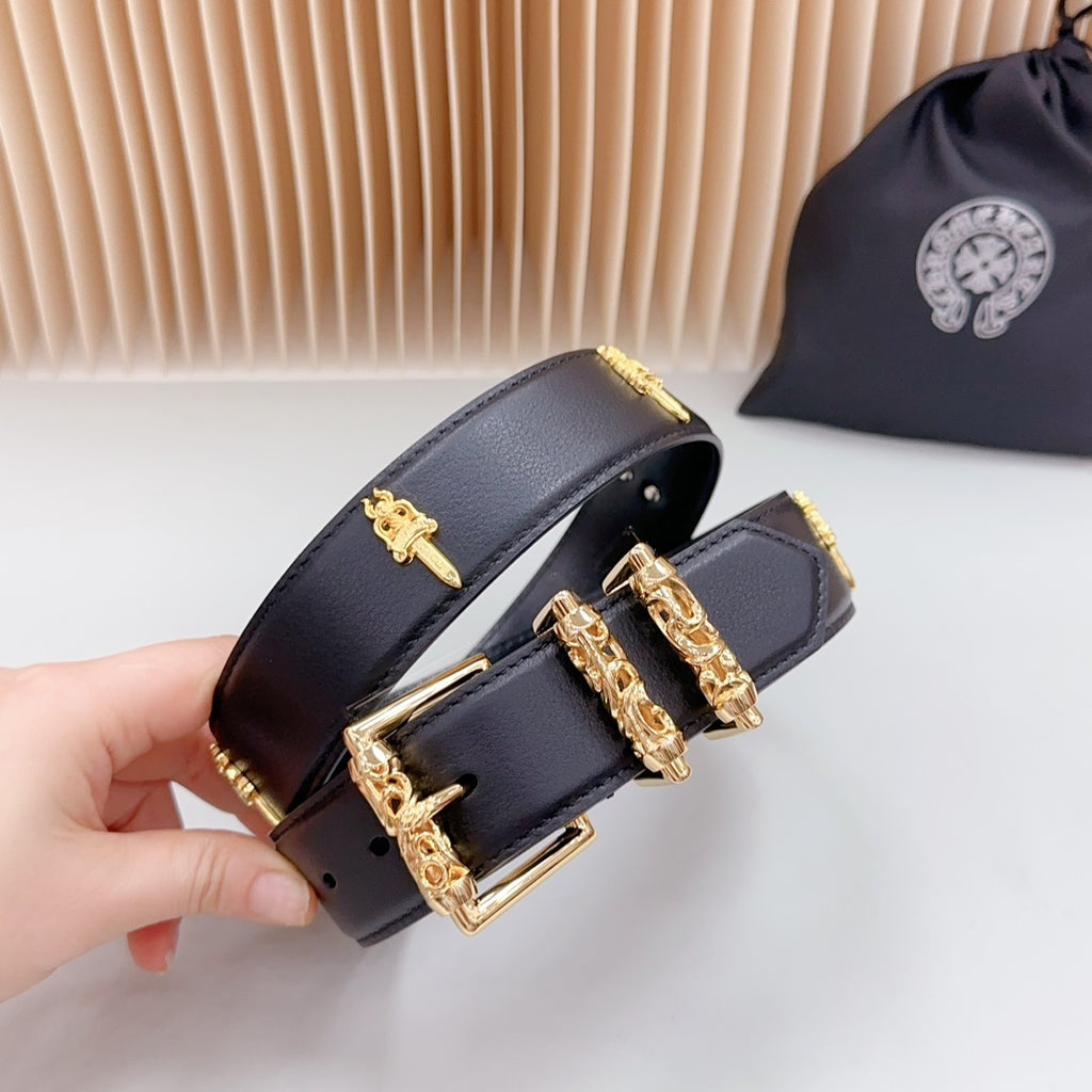 Navy leather belt end with gold buckle and cross charm details, close-up