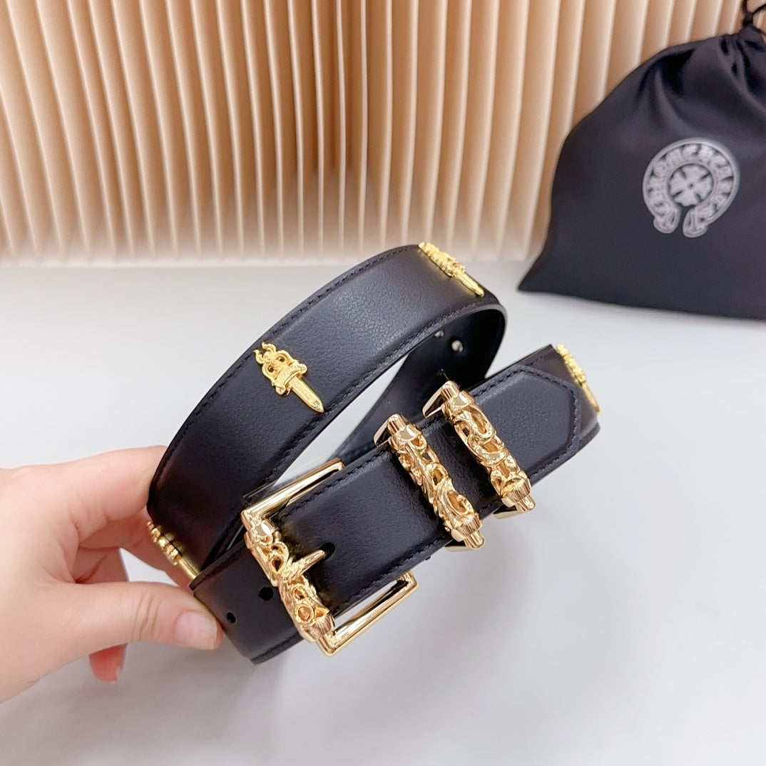 Navy leather belt end with gold buckle and cross charm details, close-up