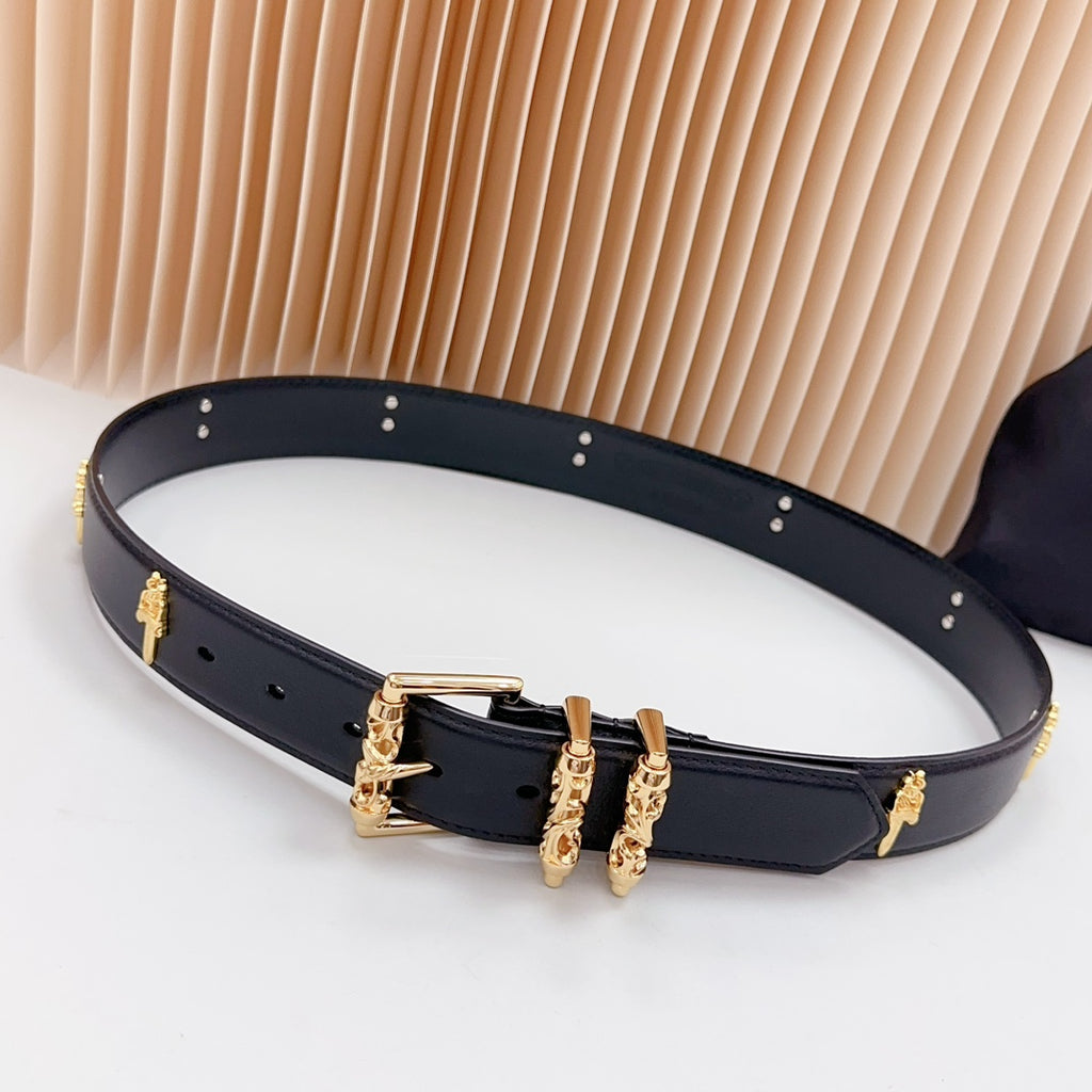 Navy leather belt with gold buckle and small cross charms, metal eyelets