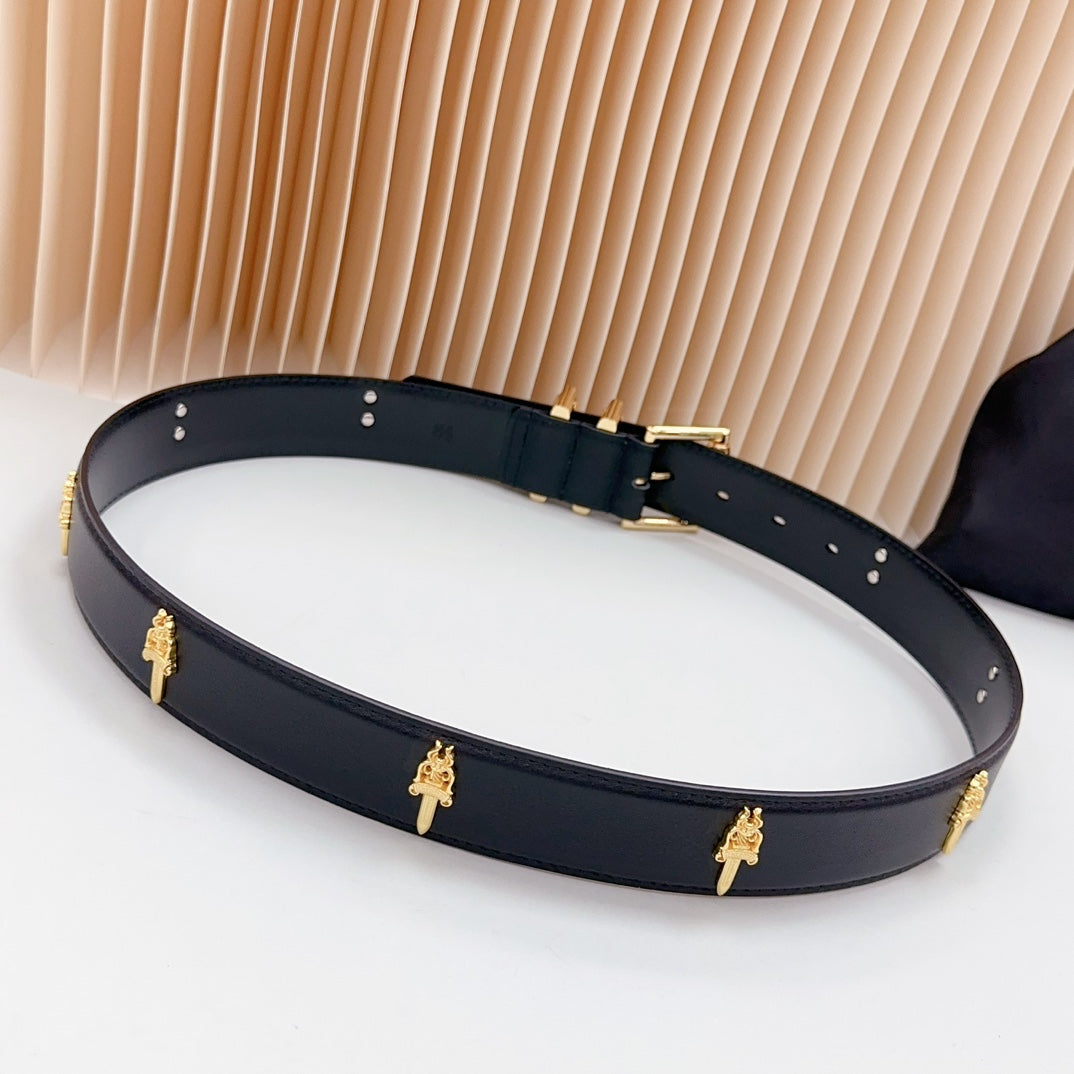 Navy leather belt with gold buckle, cross charms, and row of silver-toned holes
