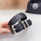 Dark leather belt close-up with chrome buckle and chain hardware, studded holes
