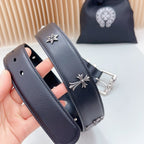 Dark leather belt with fleur-de-lis centerpiece and chrome buckle hardware