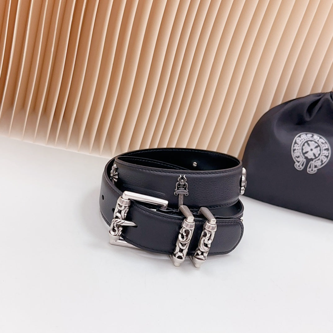 Dark leather belt with chrome buckle and chain hardware, metal studs