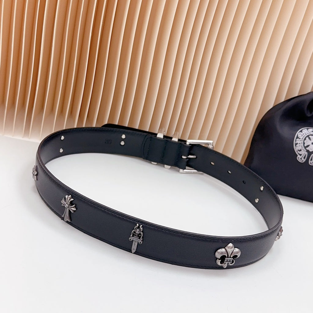 Dark leather belt with chrome clasp and fleur-de-lis accents, metal studs
