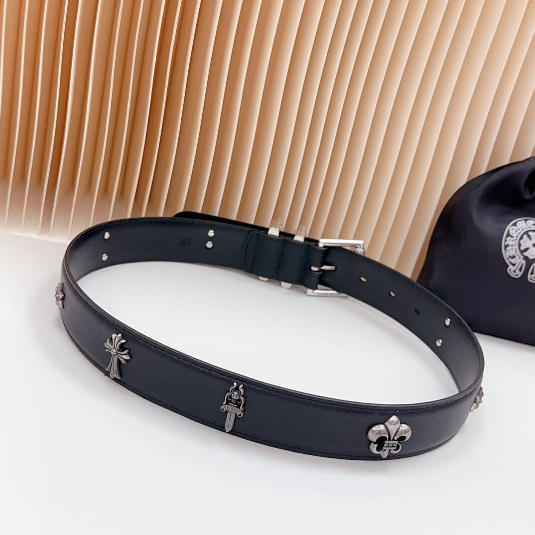 Dark leather belt with chrome clasp and fleur-de-lis accents, metal studs