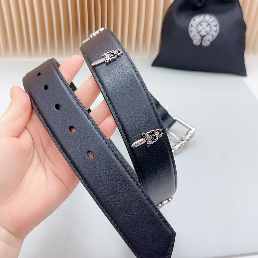 Dark belt strap with chrome chain loop and buckle hardware, held in hand