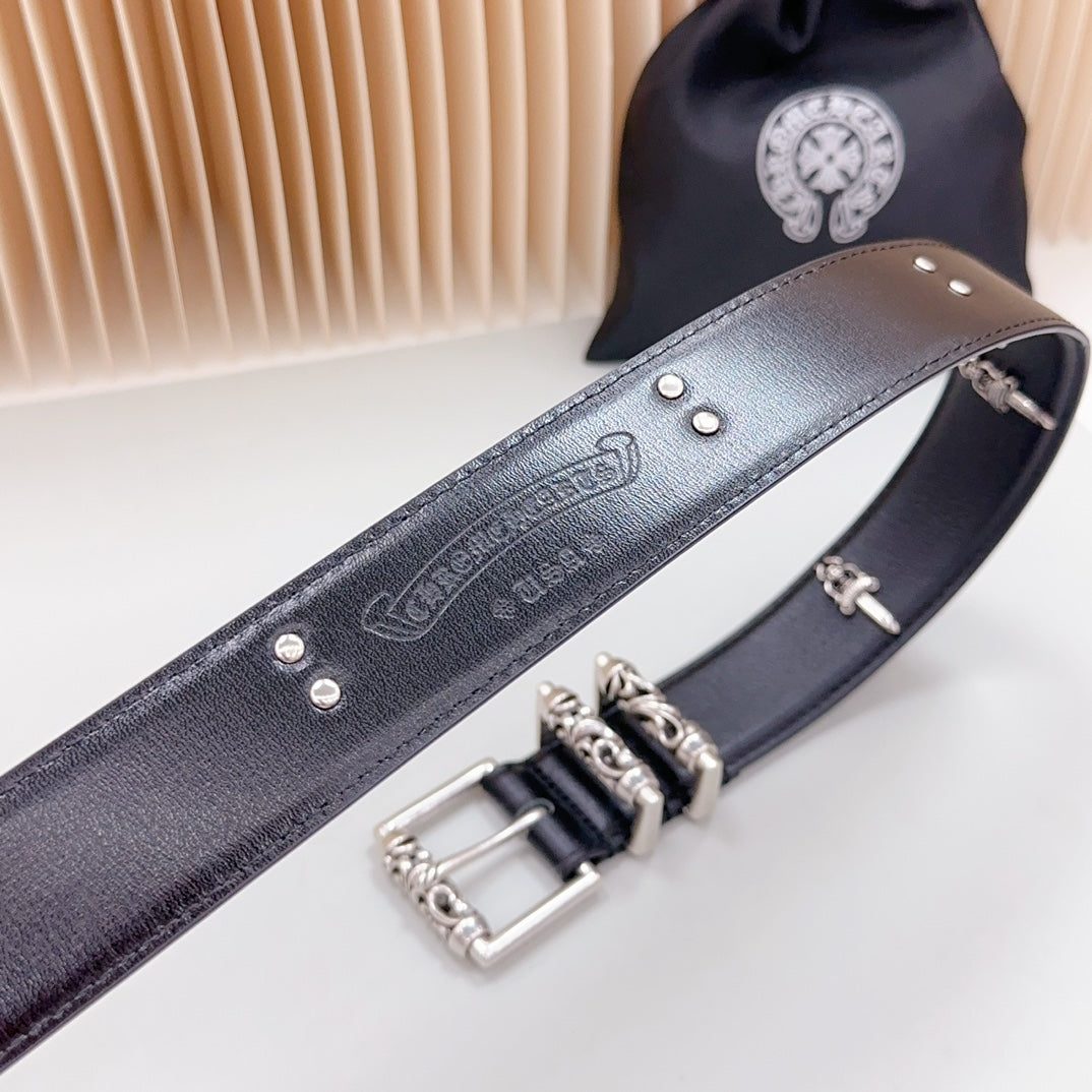 Dark belt with embossed lettering and chrome buckle hardware, angled close view