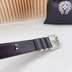 Dark belt with chrome square buckle and stitched strap, small brand mark visible