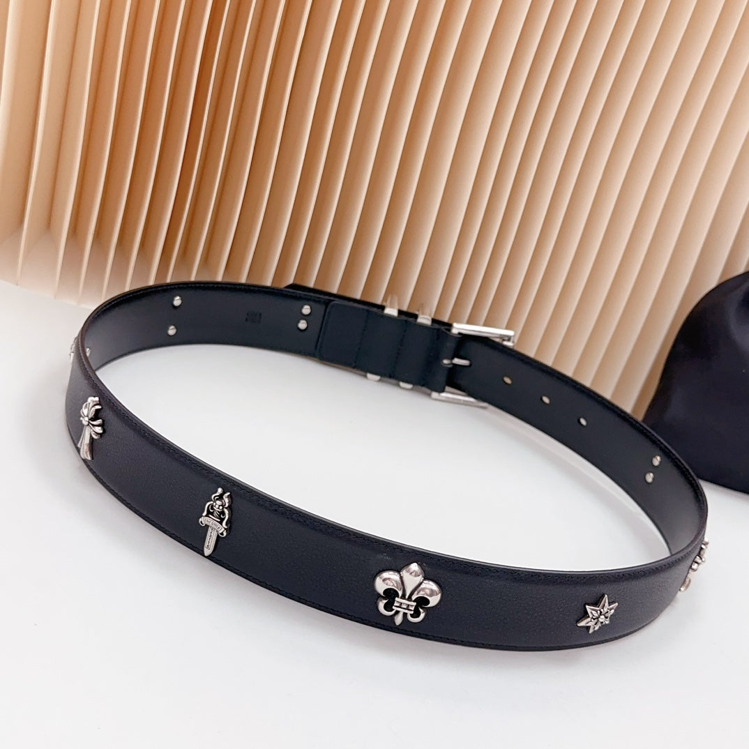 Chrome belt with dark leather and silver charms, star and fleur-de-lis on the band