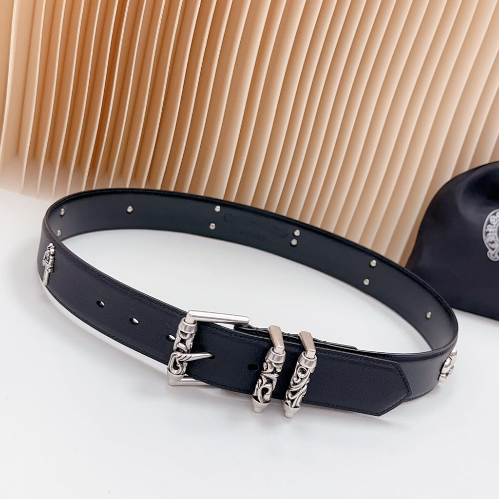 Chrome belt with dark leather and silver buckles, stud trim, and cross charm detail