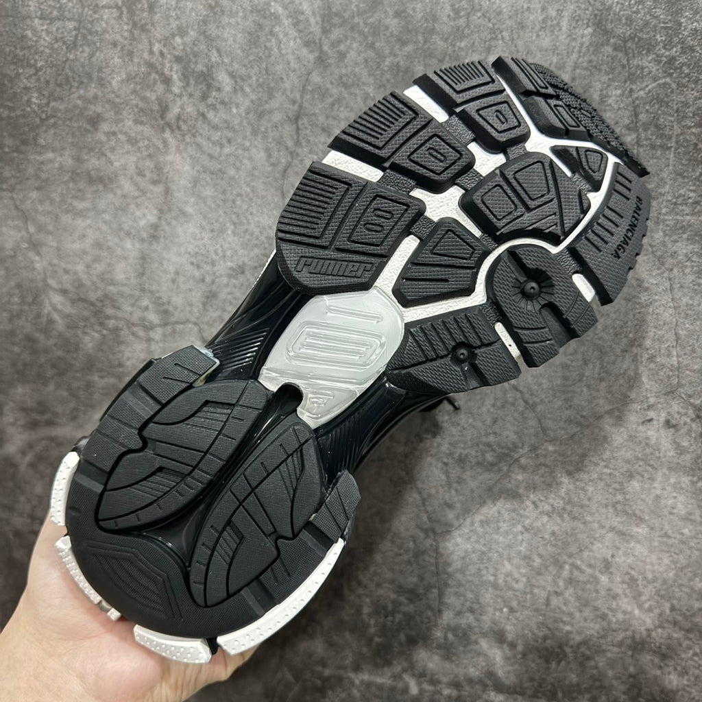 Unisex sneakers outsole tread with black and white rubber sections.