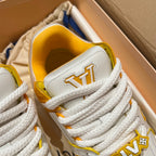 White low-top trainer sneaker close-up of collar and lace area with yellow interior