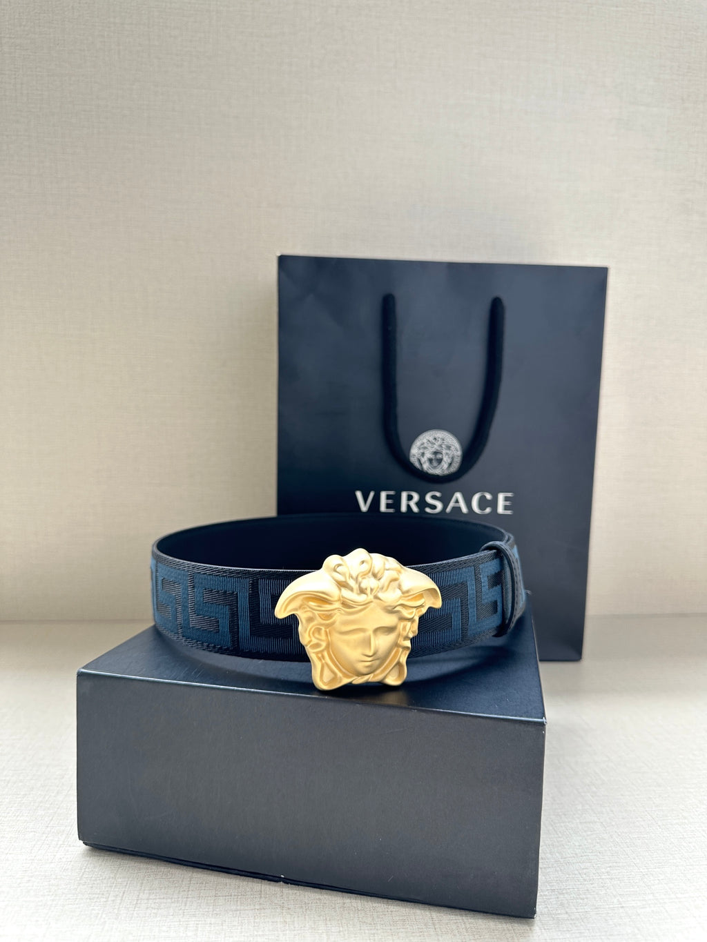 Versace belt with blue Greca strap and gold Medusa buckle, on gift box