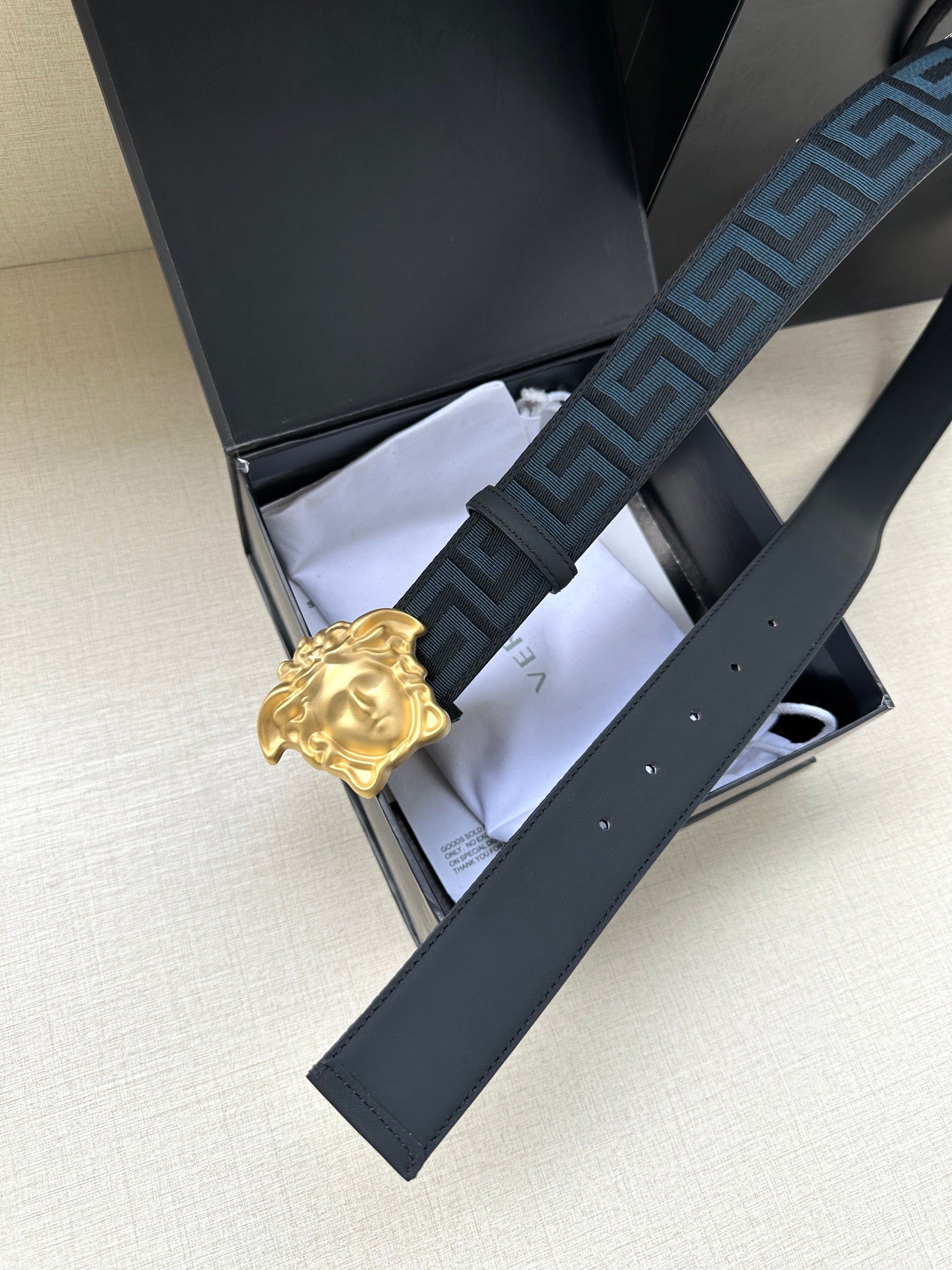 Versace belt with blue Greca strap and gold Medusa buckle, in box packaging