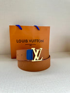 Tan monogram belt with silver LV buckle and blue keeper tab