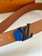 Close-up tan belt strap with embossed texture and blue LV buckle hardware