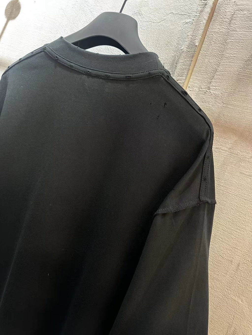 Balenciaga short-sleeve T-shirt, black close-up of shoulder and collar