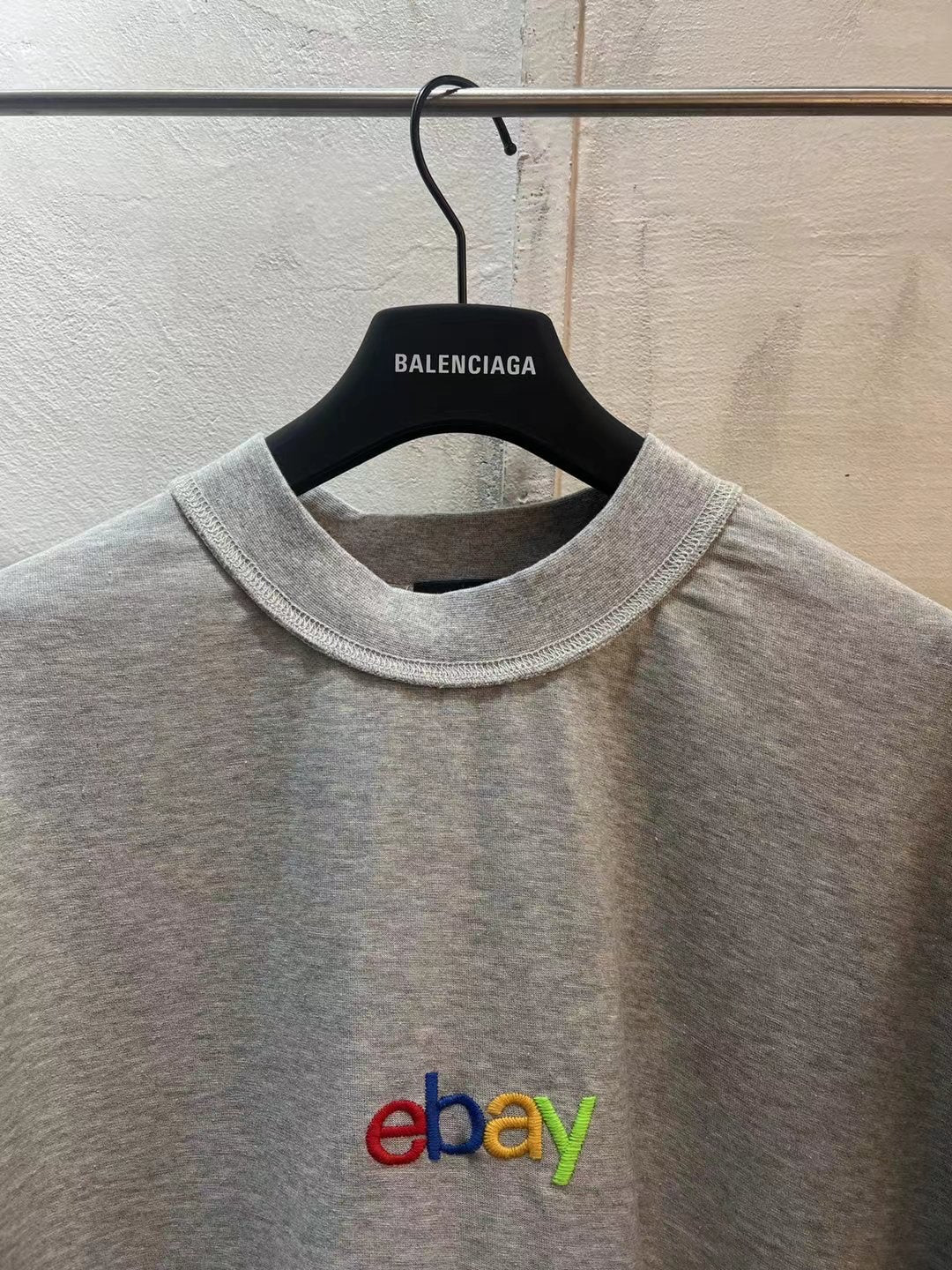 Heather gray short-sleeve T-shirt close-up, crew neck with eBay multicolor logo