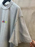 Gray short-sleeve T-shirt side view with crew neck and eBay logo on front