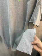 Heather gray T-shirt close-up, short sleeve hem with stitched cuff