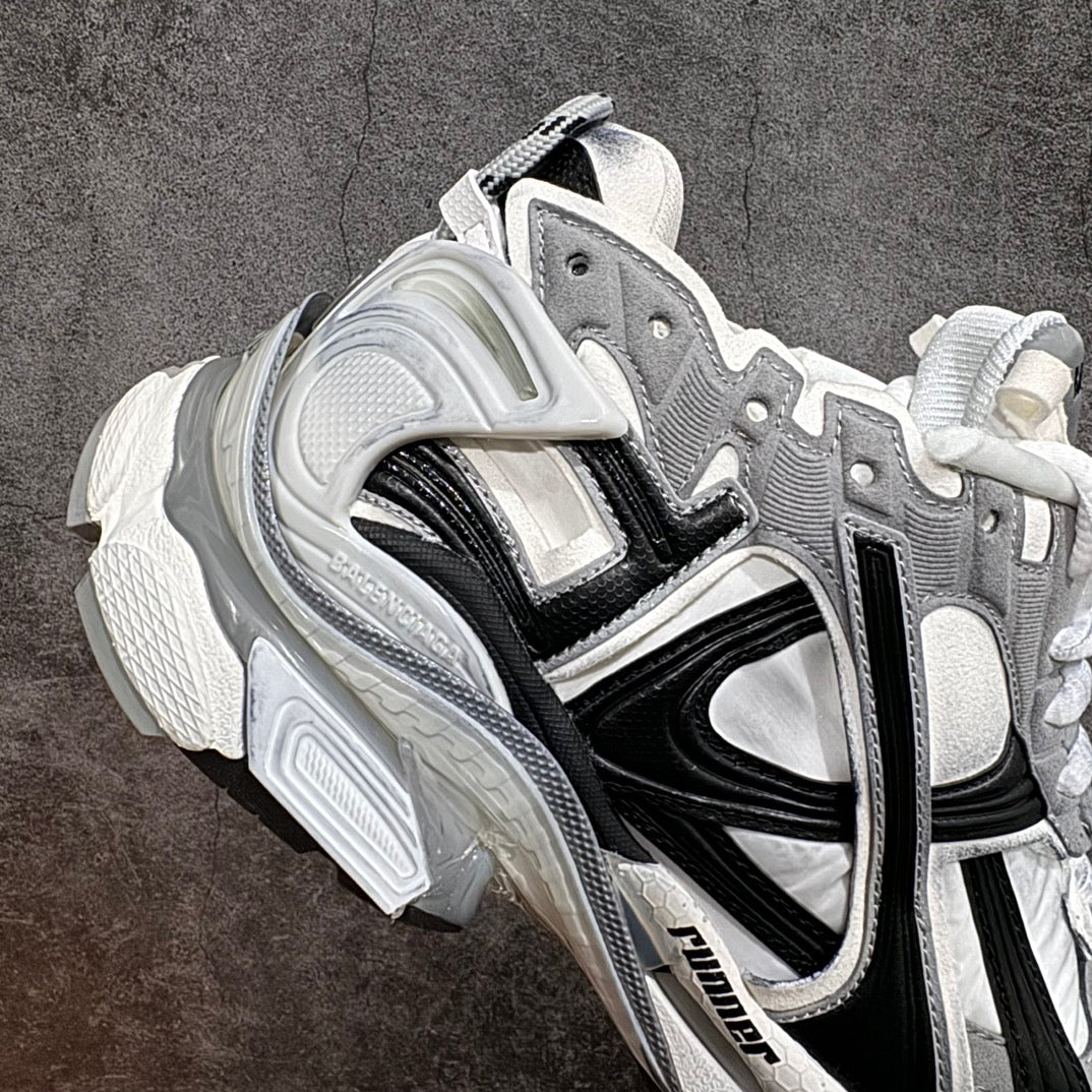 Balenciaga unisex sneaker angled side view in white, gray, and black with thick sole
