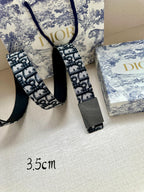 Dior belt with blue logo jacquard and gray buckle, strap ends visible, 3.5cm