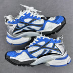 Balenciaga unisex sneakers angled view, white upper with blue panels and black sole
