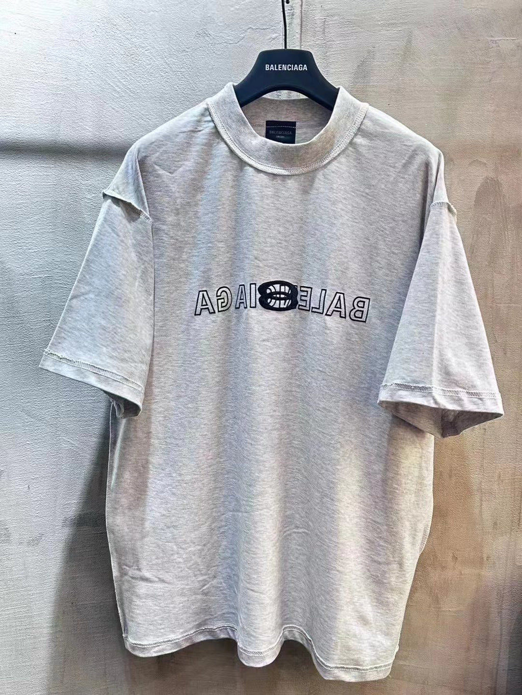Light gray Balenciaga short-sleeve T-shirt with crew neck and front logo graphic