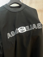 Dark navy Balenciaga short-sleeve T-shirt close-up of crew collar and logo print