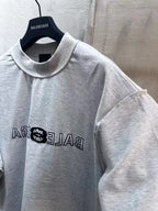 Light gray Balenciaga short-sleeve T-shirt front close-up with logo print on chest