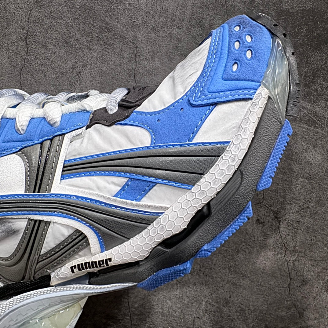 Balenciaga unisex sneakers close-up, thick sole edge with blue stripe and grey tread